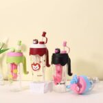 Dopamine-style plastic water bottle, cute children's straw cup with carrying strap.
