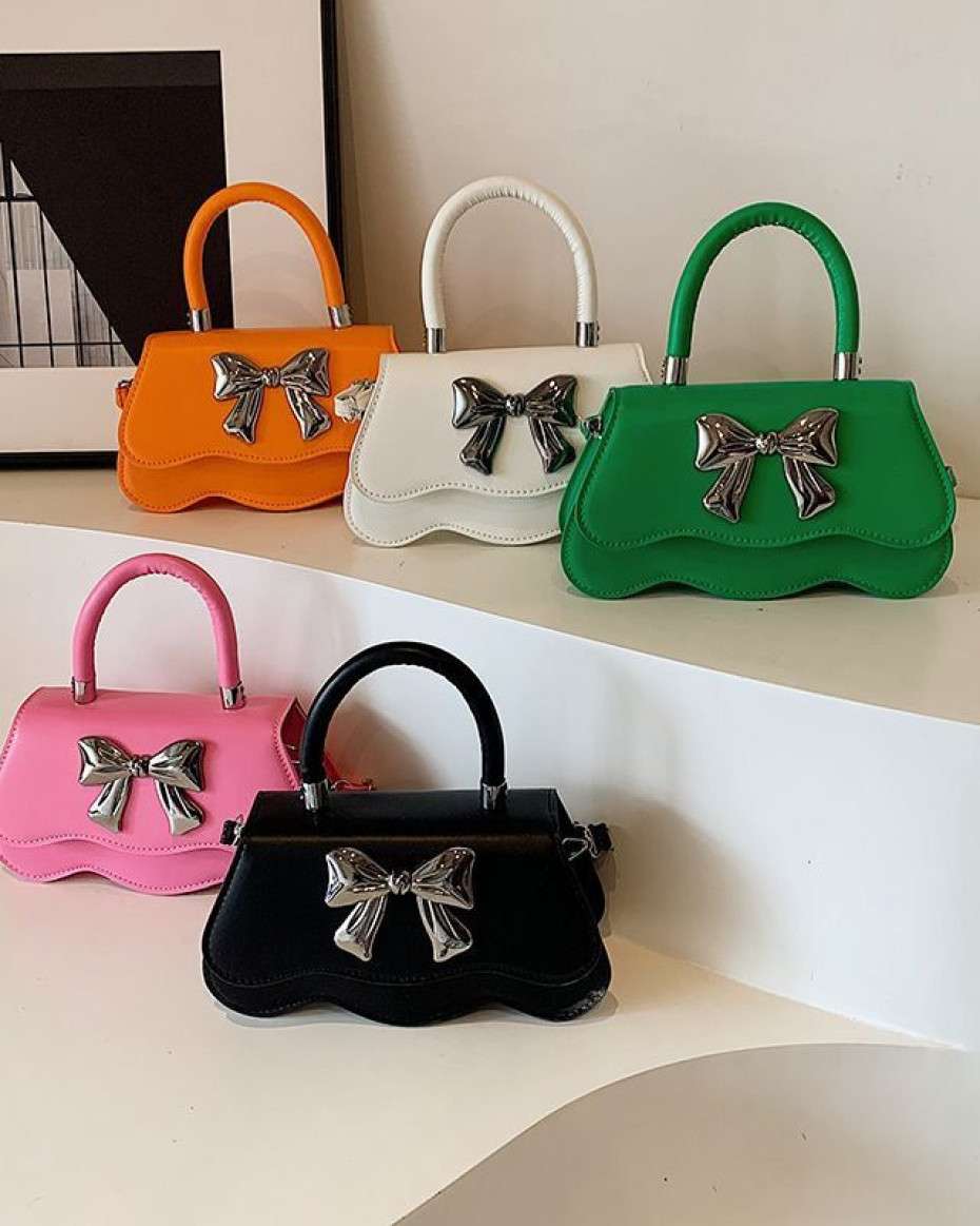 38026766c07f546432e5bbc9503606a7e8772bca.jpeg Cool Bow Bag. - Image 1