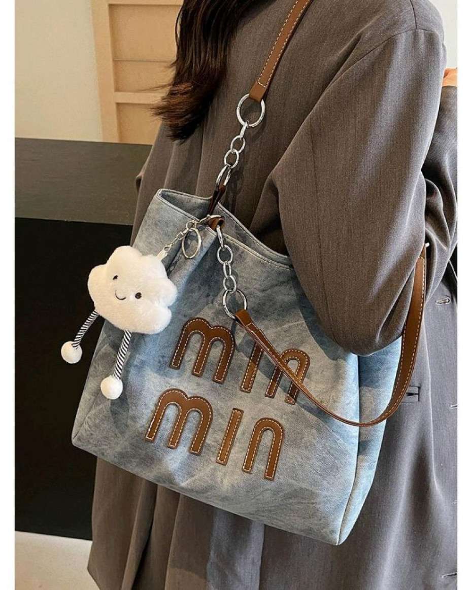4f20f34563a1c8c90efecc44dadc1b2606315514.jpeg Min Min Denim Tote Bag - Image 1