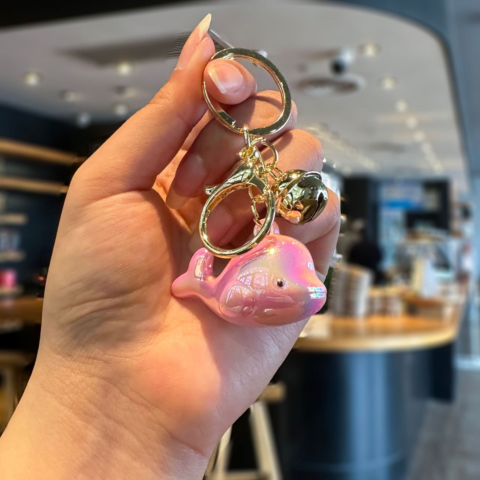 2026/06/374067.jpg Creative electroplated iridescent dolphin acrylic keychain pendant, cute color-changing bell, colorful student backpack pendant - Image 1